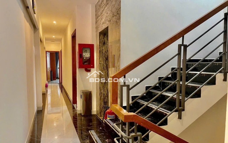 Bán CHDV hẻm 8m Quang Trung ngang 6.7m 134m2 6 lầu 21PN T.máy DT 115tr 26 tỷ gần chợ.